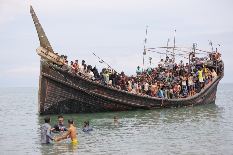 Rohingya refugees, mostly children and women, undertake perilous journeys at sea in the hope of finding safety